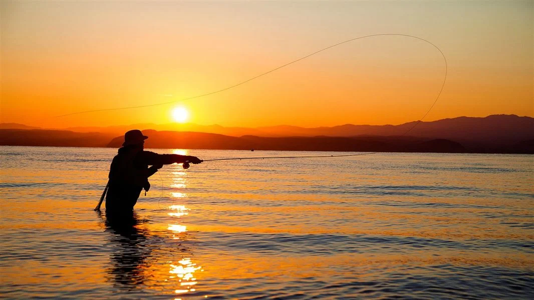 A fisherman at sunset